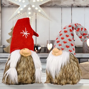 Pair of Christmas gnomes with knitted snowflake and heart hats for festive home decor