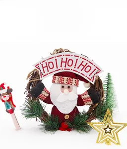 Detail of Christmas rattan wreath with gnome doll and HO! HO! HO! banner decoration