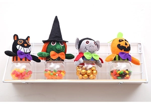 Detailed set of four Halloween candy jars with plush black cat, witch and pumpkin lids