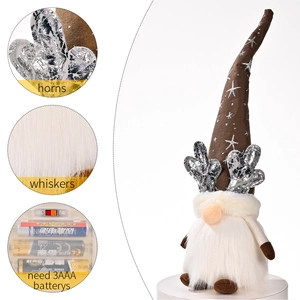 Light-up Christmas reindeer gnome with sequined antlers and warm glowing LED body