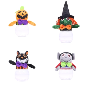 Halloween character candy jars with plush lids featuring pumpkin witch and black cat