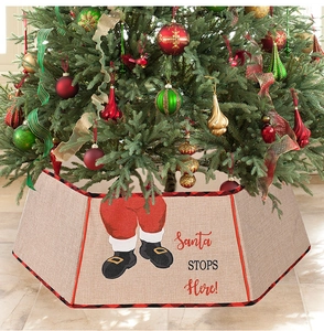 Detail of faux burlap Christmas tree collar with red plaid trim and Santa boots pattern