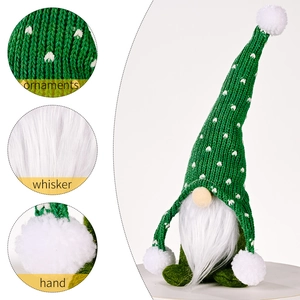 Christmas forest gnome plush in green knitted hat with white hearts and soft pom-poms