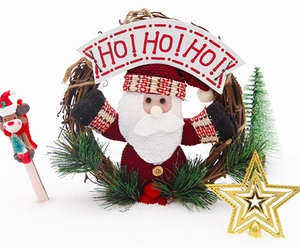 Close-up of Santa Claus doll in a natural rattan Christmas wreath with HO! HO! HO! sign