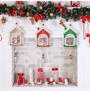 Detailed view of 3pcs wooden Christmas house ornaments with Santa, Snowman and Reindeer motifs