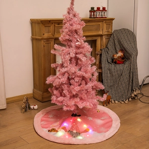 Pink Christmas tree with plush lighted tree skirt and cartoon faceless gnome decoration