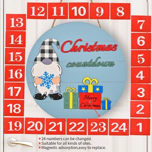 Detail of Christmas countdown calendar featuring a gnome and 24 magnetic number squares