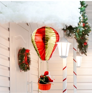 Detail of red and gold Christmas hot air balloon ornament with Santa Claus figure