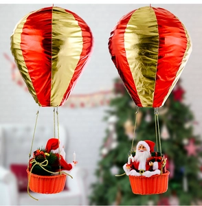 Detail of Santa Claus in red and gold hot air balloon hanging Christmas decoration