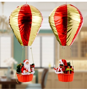 Detail of Santa Claus in a red and gold hot air balloon with gift boxes and candy canes