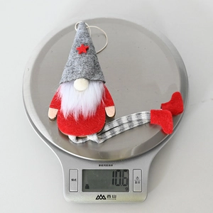 Close-up of lightweight Christmas gnome ornament showing detailed fabric and 10.6g weight
