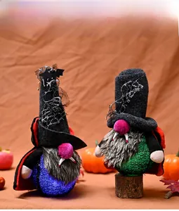 Detail showing glowing LED base of vampire gnomes with knitted spider web hats and capes