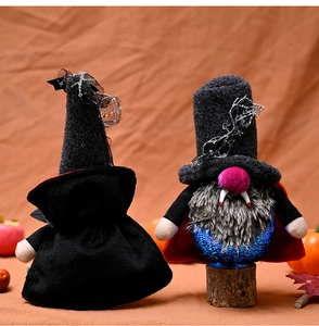 Detail of Halloween vampire gnome featuring black lace wizard hat and glowing sequin body