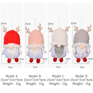 Detail view of gnome plush ornaments showing lamb velvet hats and reindeer antlers