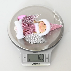 Detailed view of pink angel ornament with sequins on scale showing 12g product weight