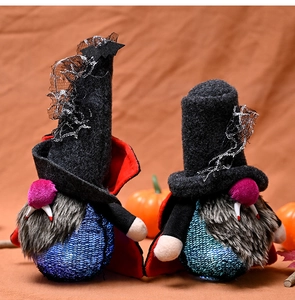 Detail of light-up Halloween vampire gnomes with bat hats and glowing bases in autumn setting
