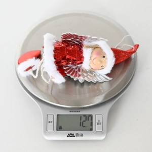 Detailed weight measurement showing 12.7g for the red sequin Christmas angel pendant