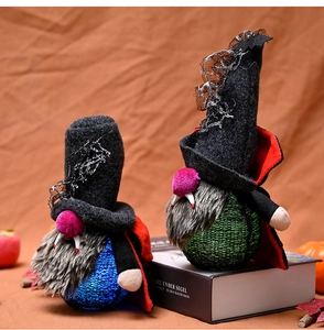 Detail of lit Halloween vampire gnomes with pointed hats, lace trim and LED glowing bodies