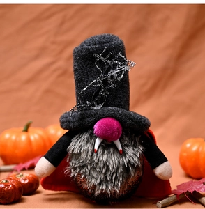 Close-up of Halloween vampire gnome with fangs and spider web lace hat details