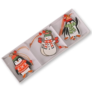 Close-up of wooden Christmas tree pendants featuring painted penguins and a snowman
