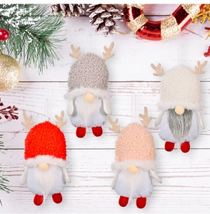 Detail of four Christmas gnomes with reindeer antlers and plush hats on a festive background