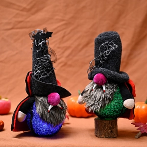 Pair of glowing Halloween vampire gnomes with LED lights, bat wings and plush texture
