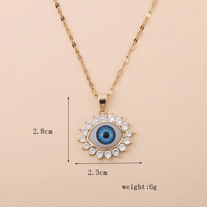 Detailed view of the 18K gold evil eye pendant showing its dimensions and weight