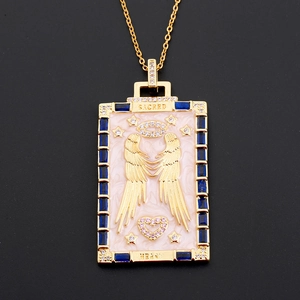 Golden tarot angel necklace with pink enamel and blue crystals on black background