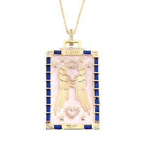 Golden Tarot card necklace featuring blue crystal borders and pink enamel angel wings