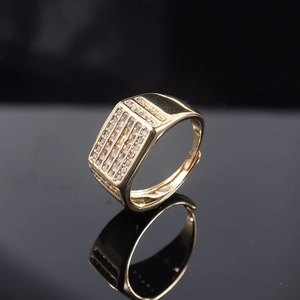 Macro shot of gold plated men's wide ring featuring micro-pave rectangular zircon rows