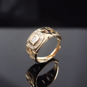 Detailed macro shot of gold-plated ring featuring zircon inlay and hollow geometric lines