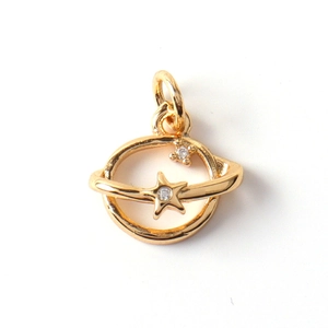 Detail of Saturn-shaped gold pendant with cubic zirconia stones on white background