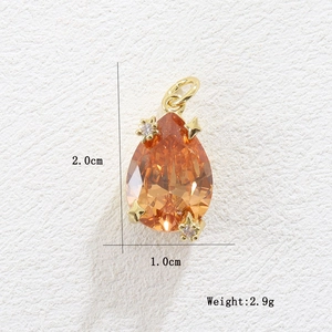 Detailed size and weight view of pear-shaped amber zircon pendant with gold accents