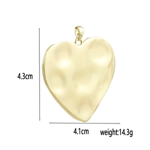 Hammered 18k gold heart pendant detail showing dimensions of 4.1cm width and 4.3cm height