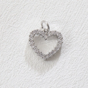 Detail of silver heart pendant with pavé set cubic zirconia and a polished jump ring