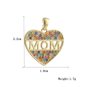 Macro view of gold MOM heart pendant with colorful zircon stones and size measurements