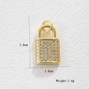 Detail of 18k gold heart lock pendant with white zircon stones and size dimensions