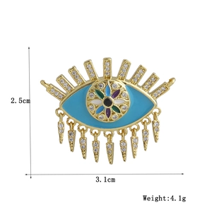 Detailed view of 18k gold evil eye pendant showing 3.1cm by 2.5cm size and 4.1g weight