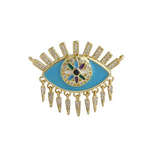 Detailed view of 18k gold plated evil eye pendant with blue enamel and zircon tassels