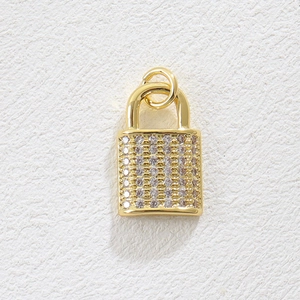 Detailed view of an 18k gold plated heart lock pendant with pavé set zirconia stones