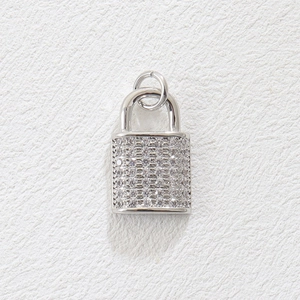 Detailed close-up of a silver-colored padlock charm fully paved with shiny zircons