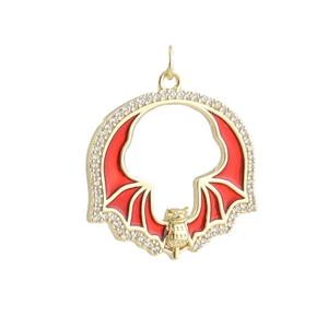 Macro detail of gothic bat pendant with red enamel wings and white zircon crystals
