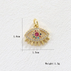Detailed view of 18k gold plated evil eye charm with colorful zircons and 1.5cm size mark
