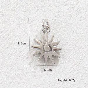 Detail view of silver sun pendant showing 1.6cm height with spiral texture and flame rays