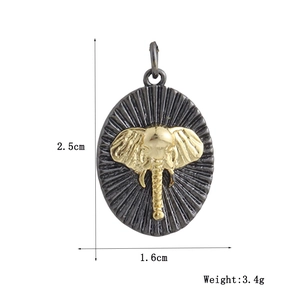 Detailed size view of an oval elephant pendant with vintage gold relief and black finish