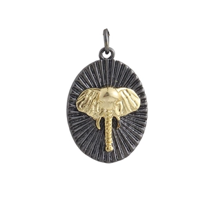 Vintage style two-tone metal elephant pendant with textured oval base and gold accent