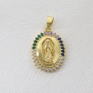 Detail of 18k gold plated Virgin Mary pendant with colorful zircon stones on white background