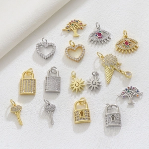 Detailed micro-pave charms with heart, evil eye, and key shapes in gold and silver finish