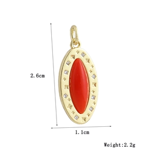 Detail view of gold oval pendant with red marquise stone and star engraving dimensions