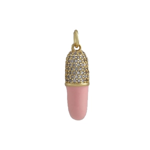 Macro detail of 18k gold capsule pendant with pink enamel and pavé zircon stones